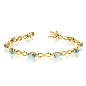 14K Yellow Gold Oval Aquamarine Stones And Diamonds Infinity Tennis Bracelet, 7"