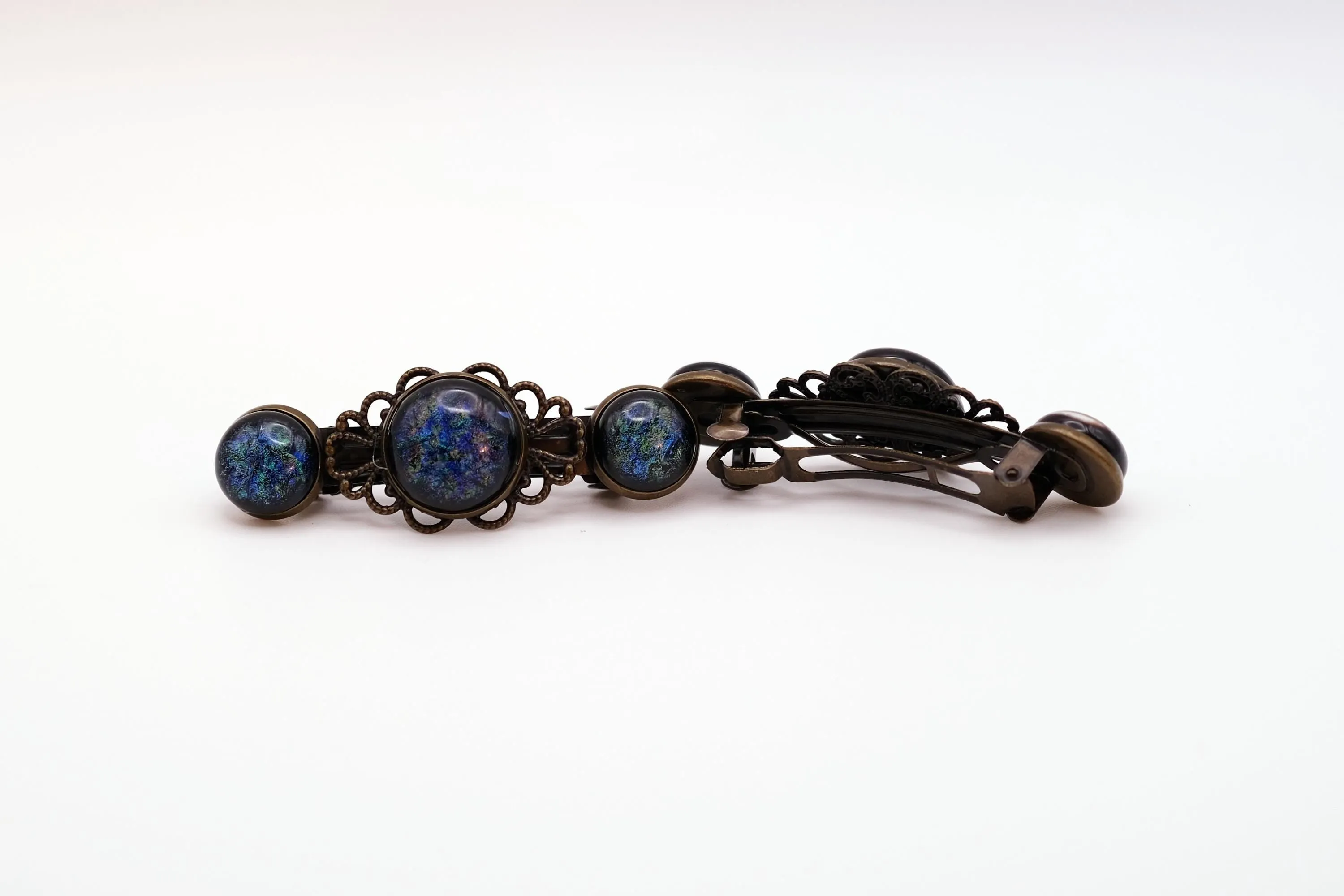 Barrette pair, bronze flowers with blue base and multicolor specs dichroic fused glass cabochons, french clip, 2 1/4 inches