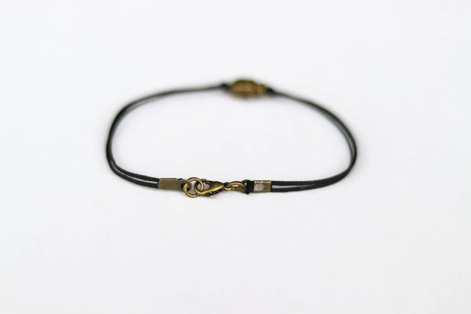 Bronze skull bead bracelet for men, black cord, gift for him